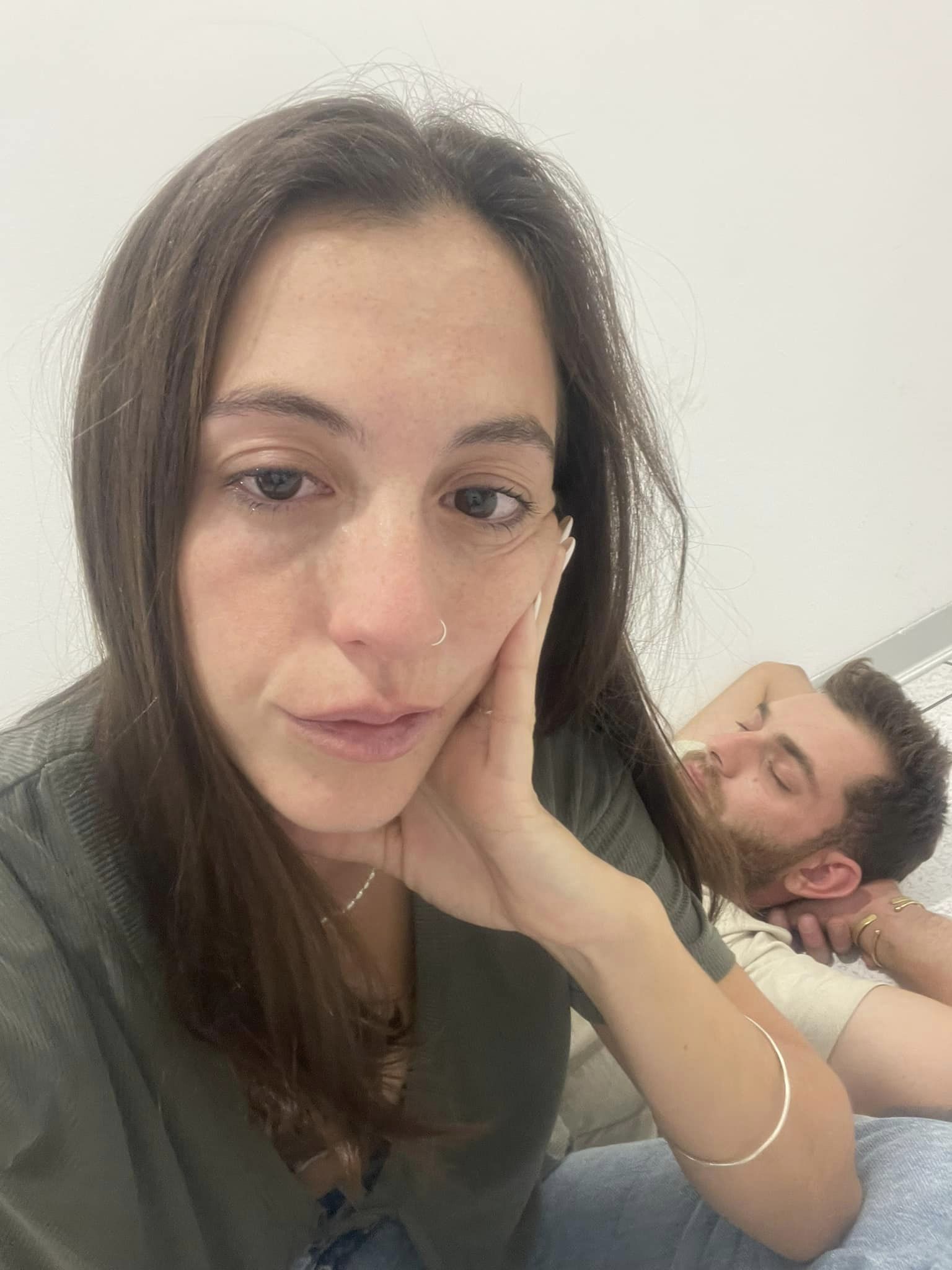 Carmel S. with tears in her eyes and behind her partner Shaked