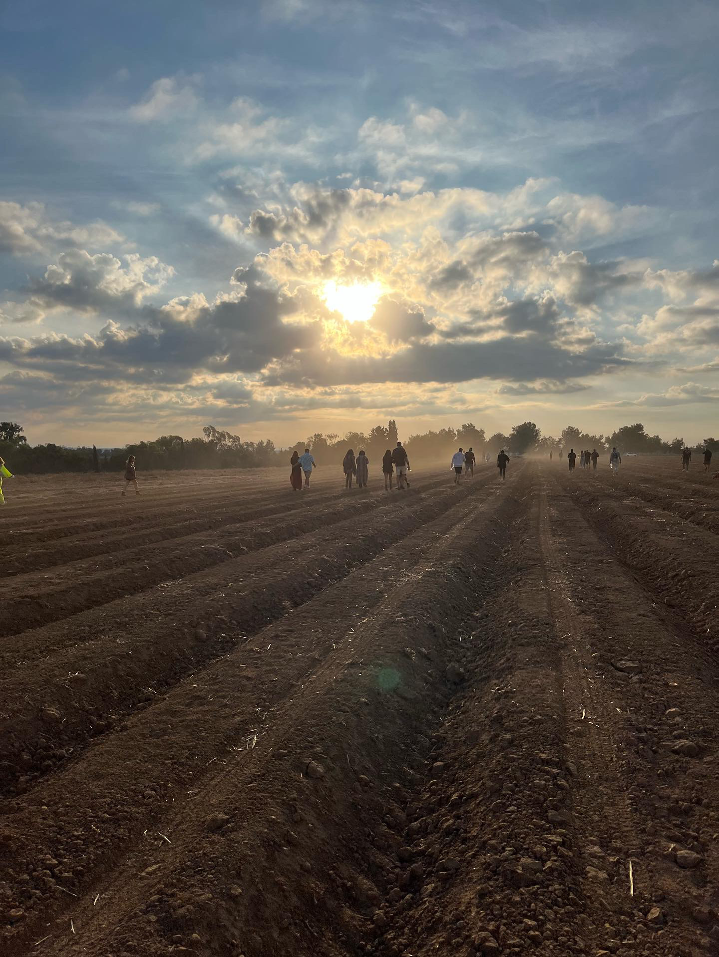 NOVA party goers walking along a field