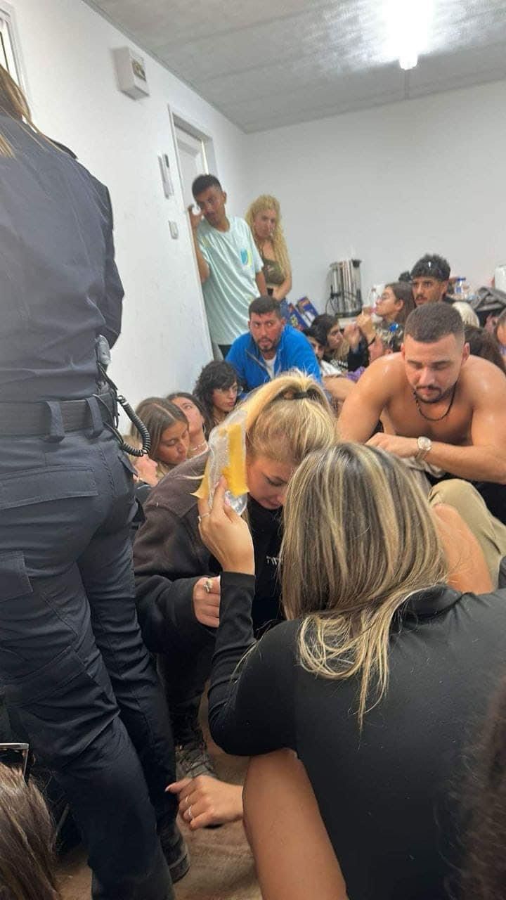 People sit on the floor of trailer