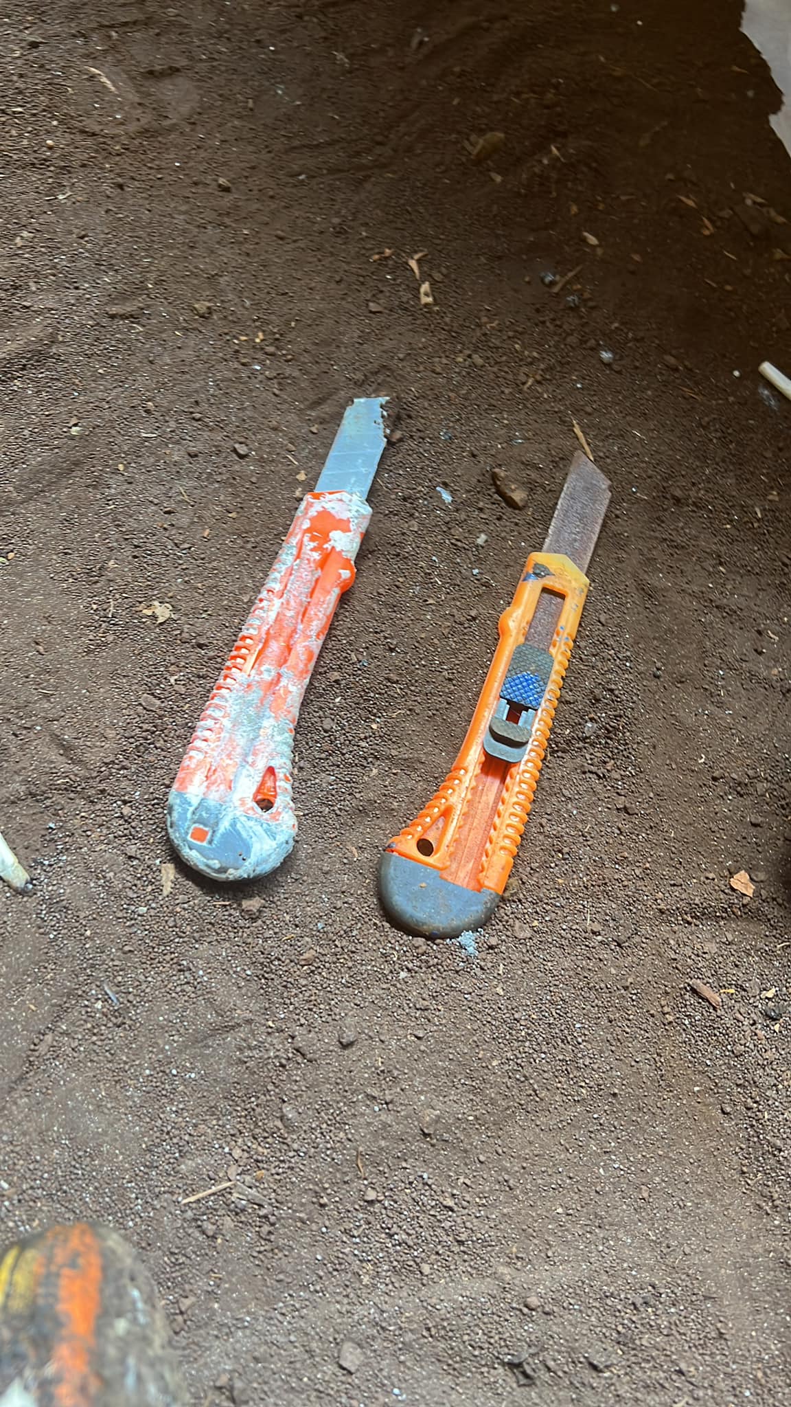 2 large wallpaper knives on the ground