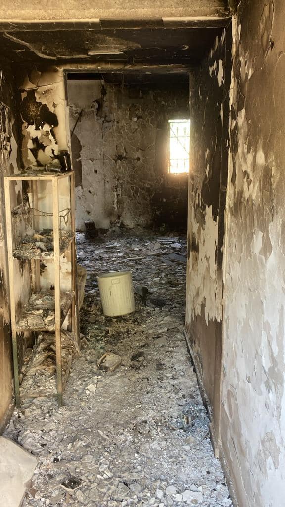 Broken floor and burnt walls and furniture