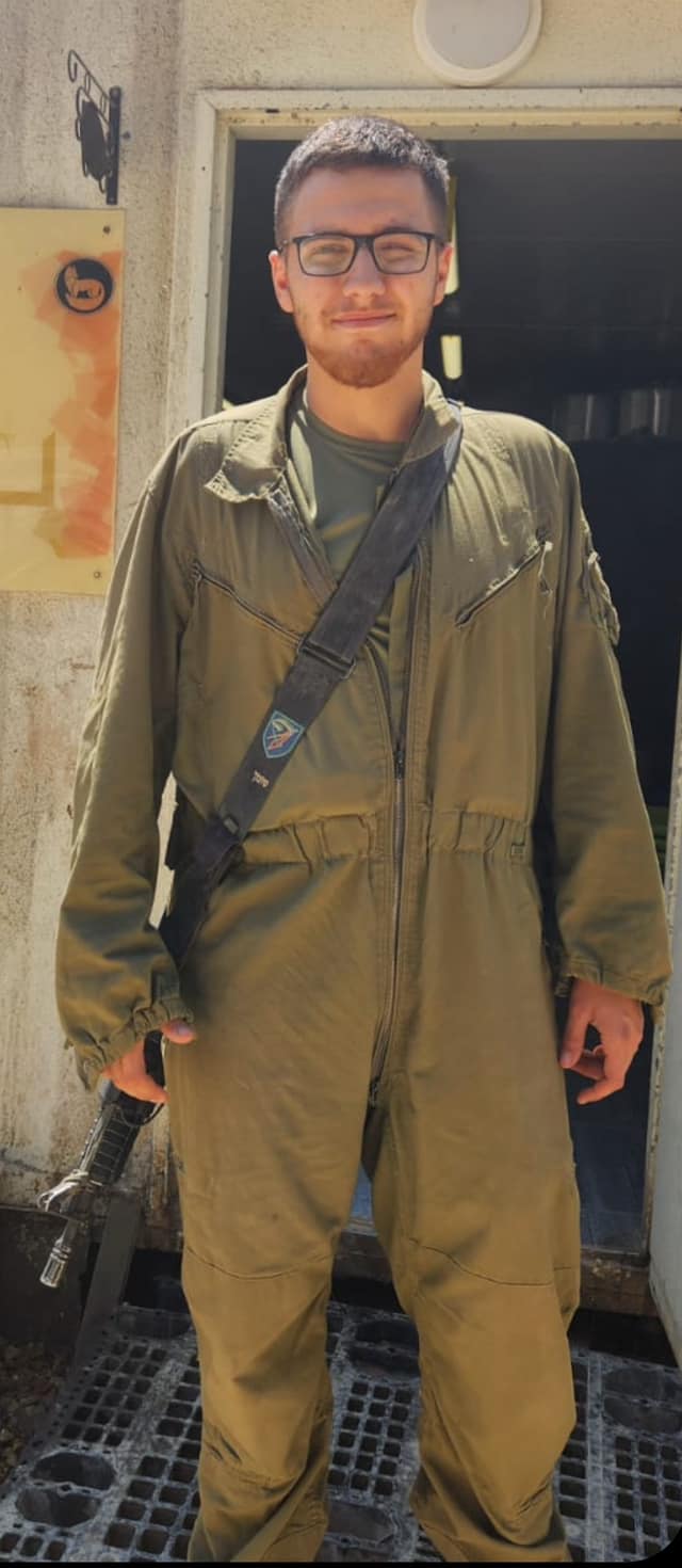 Ido S. in uniform with a weapon