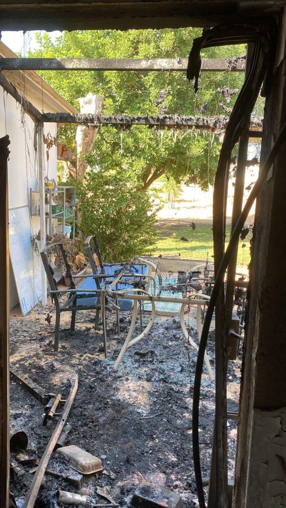 Burnt chairs and table in Jude's house