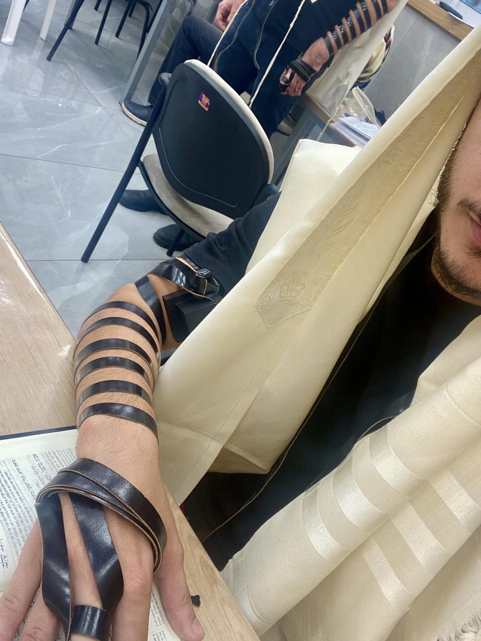 Adi B puts on tefillin