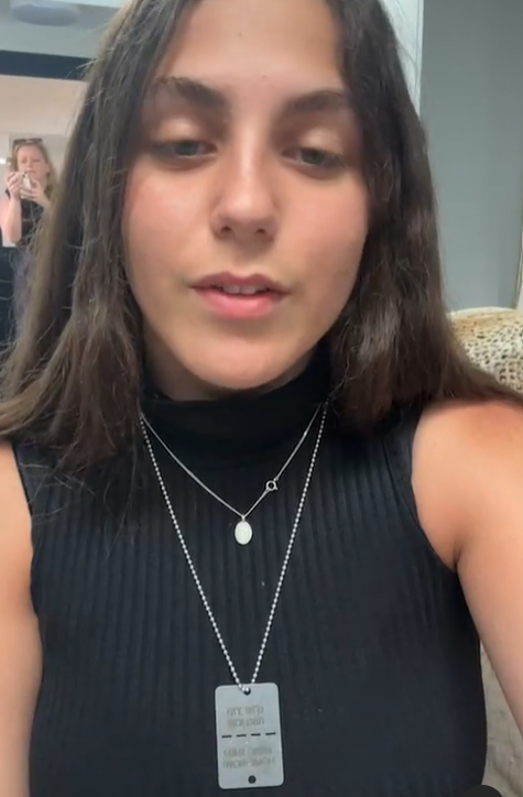 A girl taking a selfie with a worried look