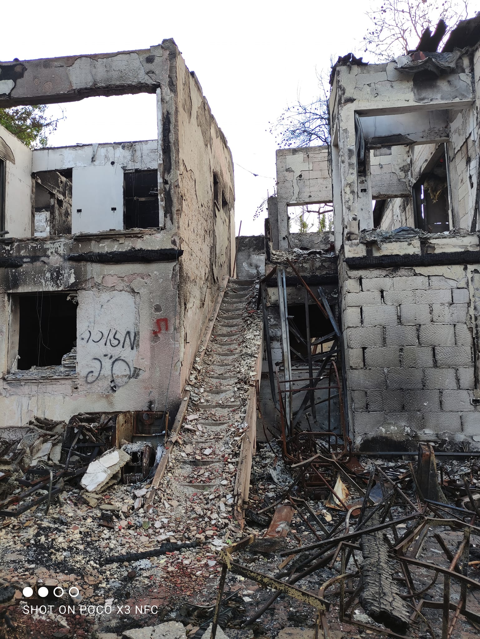 The walls and stairs of the house destroyed and burned
