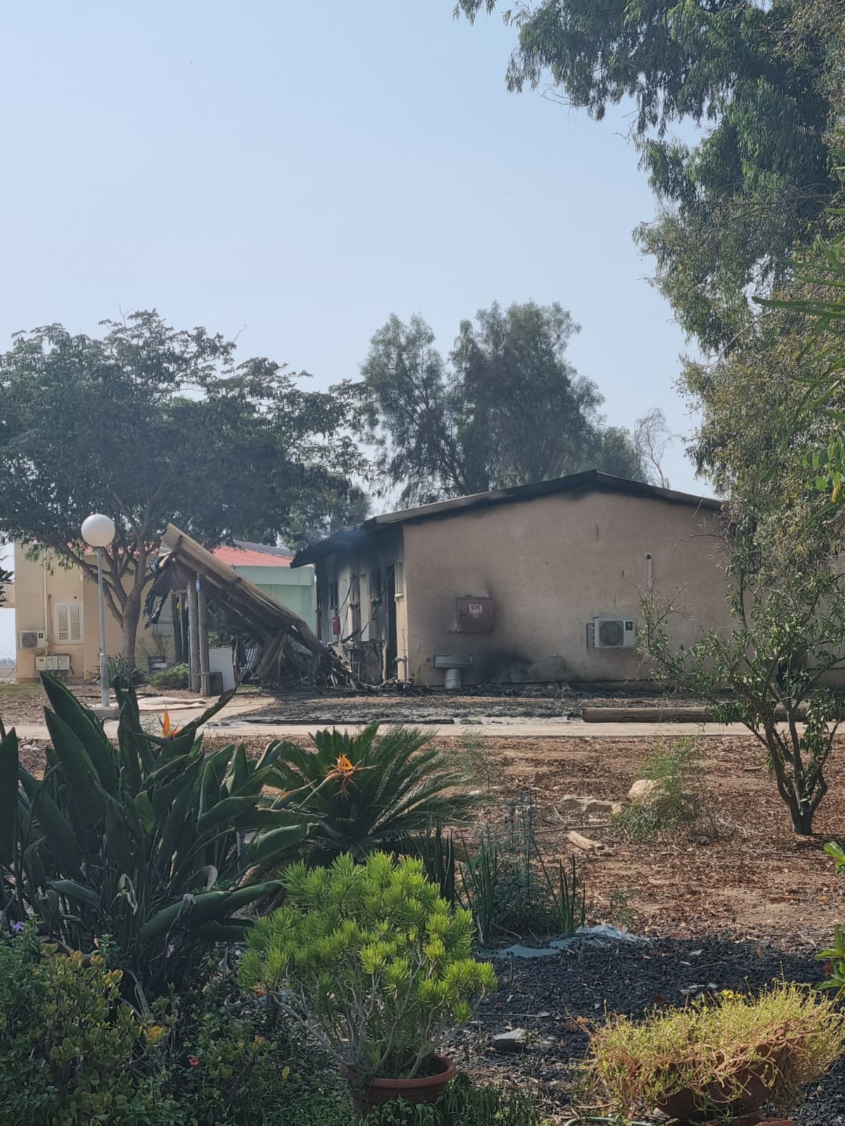 A burnt and destroyed house in the kibbutz