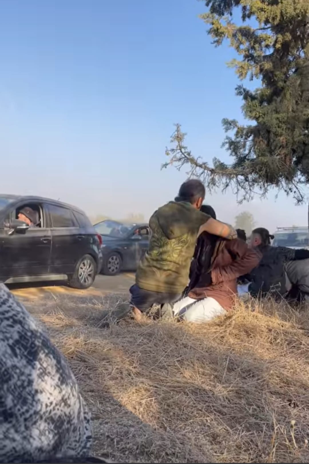People run away in cars at the Supernova festival
