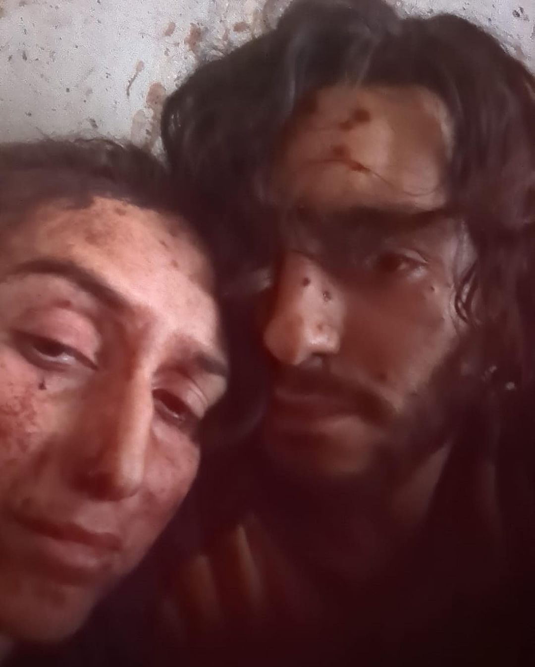 Agam and Itamar bloody and hiding