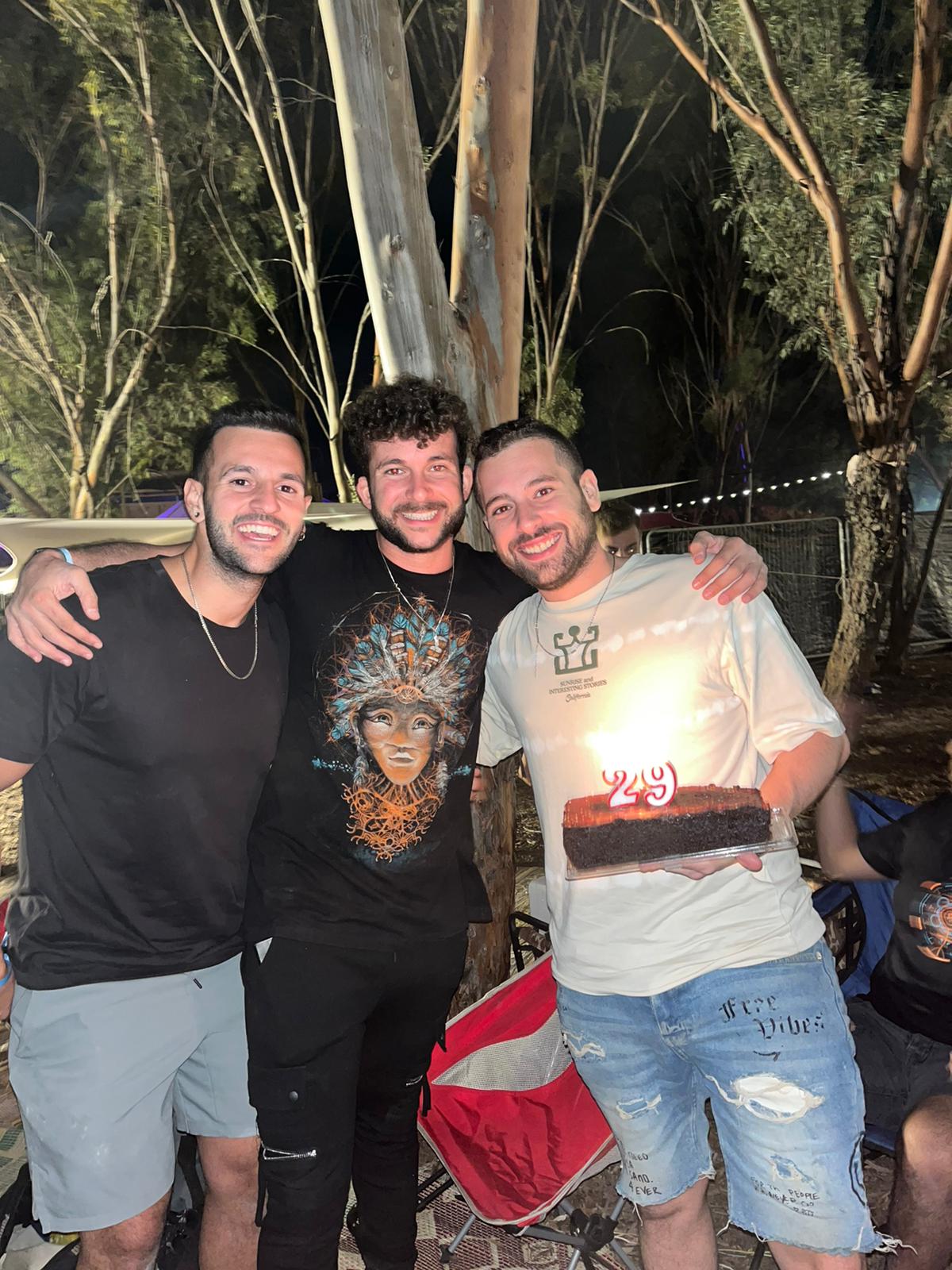 Dor E with birthday cake and friends