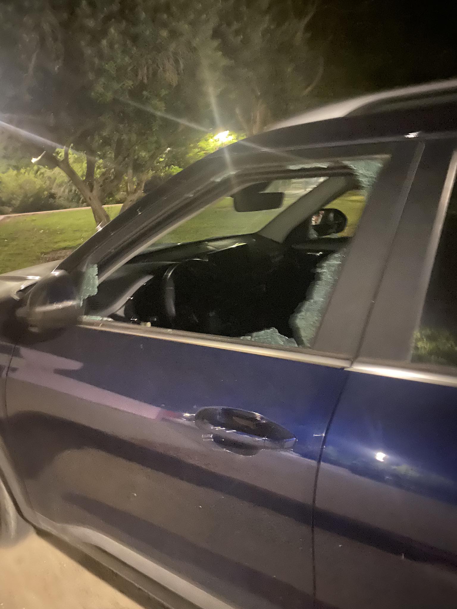 A car with a broken left window