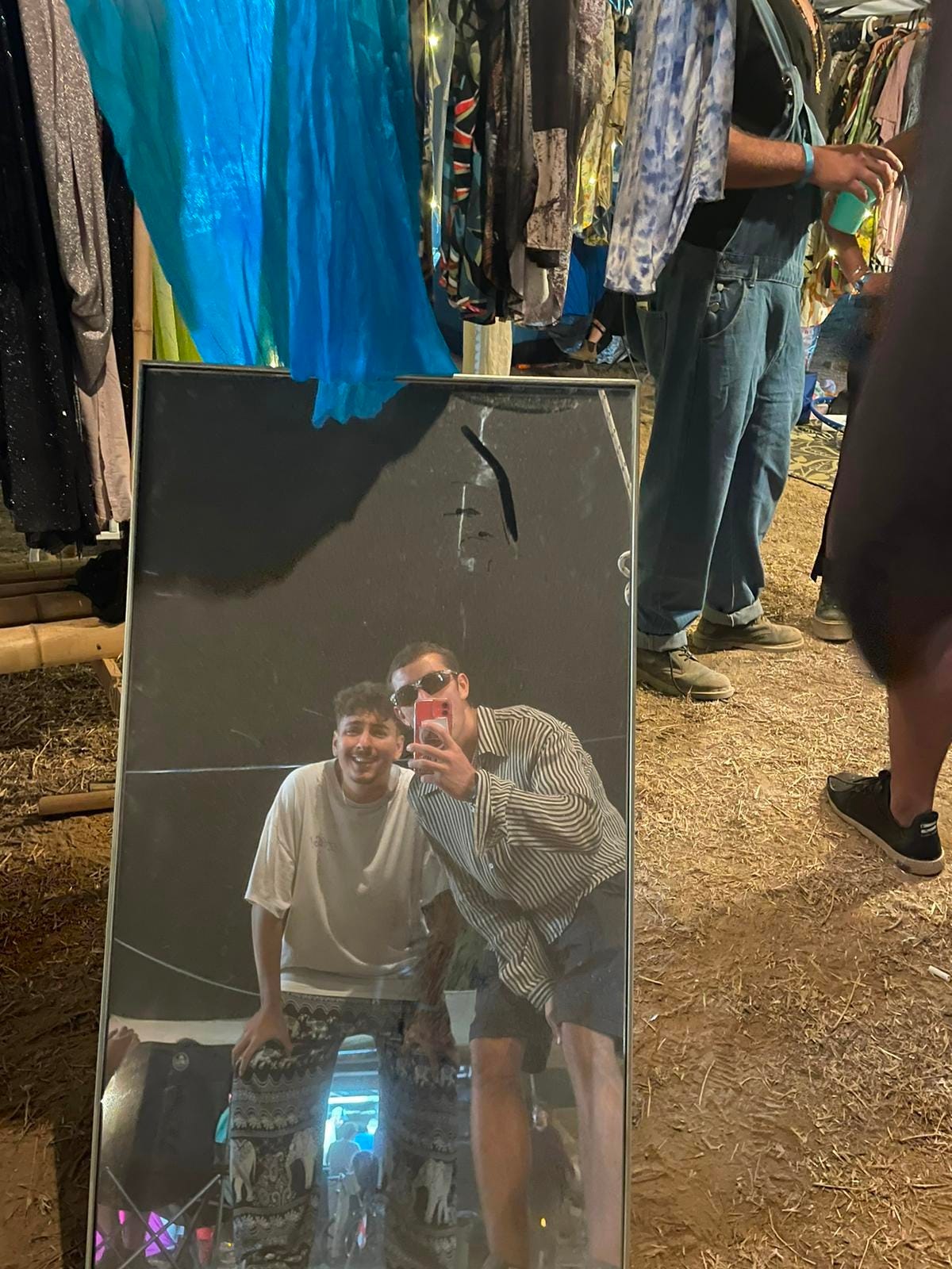 Arad F. take a picture in front of a mirror with his friend
