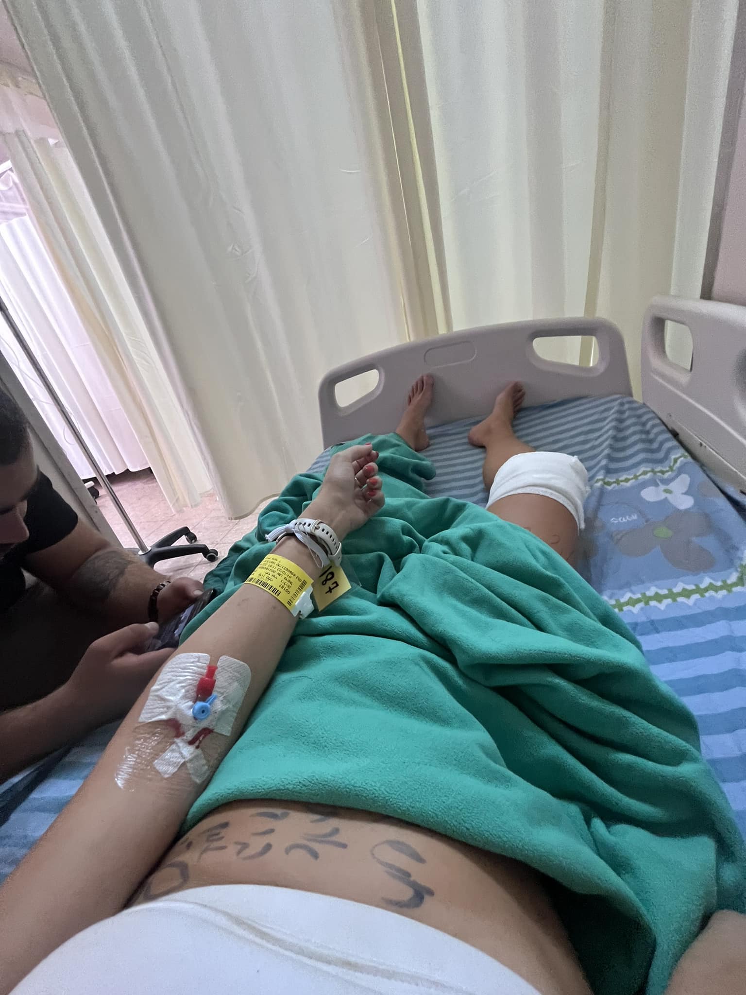 Hadar-Or E on a hospital bed with a catheter in her  vein